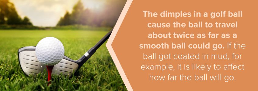 The dimples in the golf ball allow it to go further.
